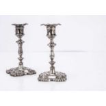 A pair of Edwardian silver filled short candlesticks,