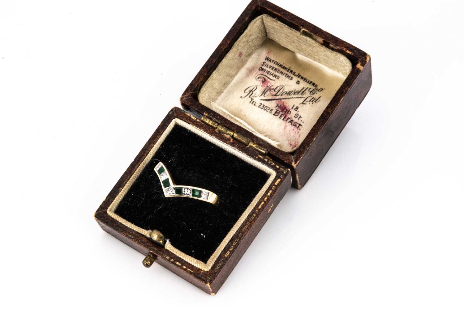 An emerald and diamond 18ct gold wishbone dress ring,