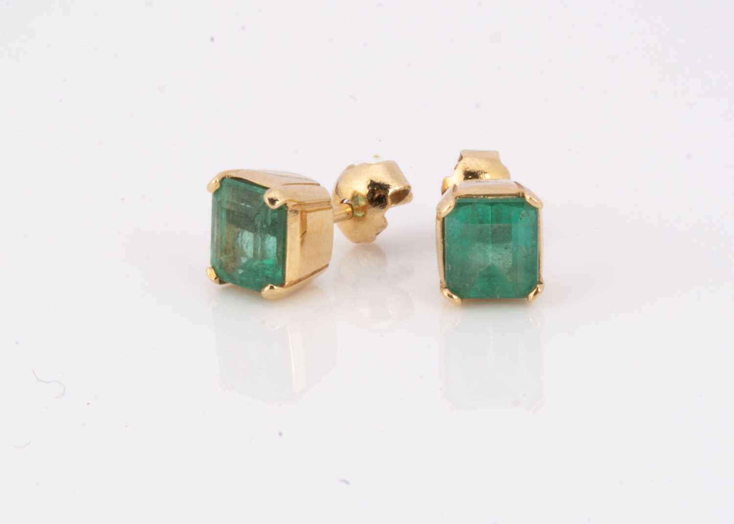A pair of continental yellow metal emerald ear studs,