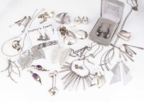 A collection of silver, white metal and plated earrings and jewels,