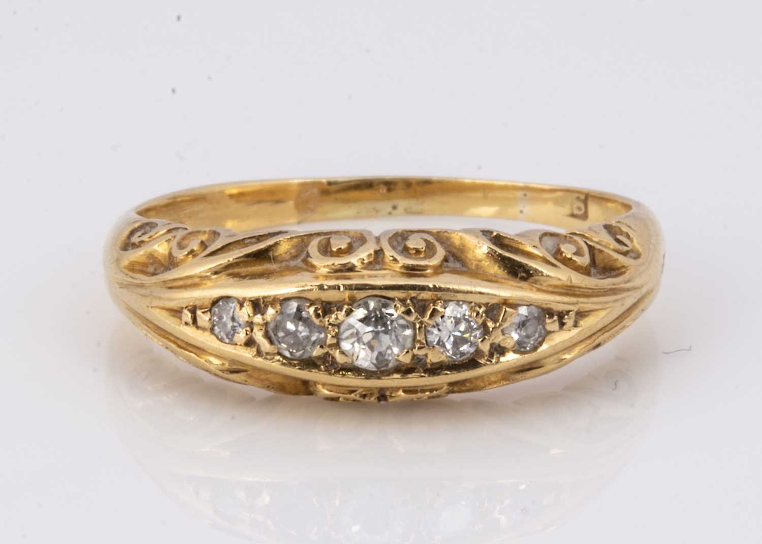 An 18ct gold five stone diamond dress ring,