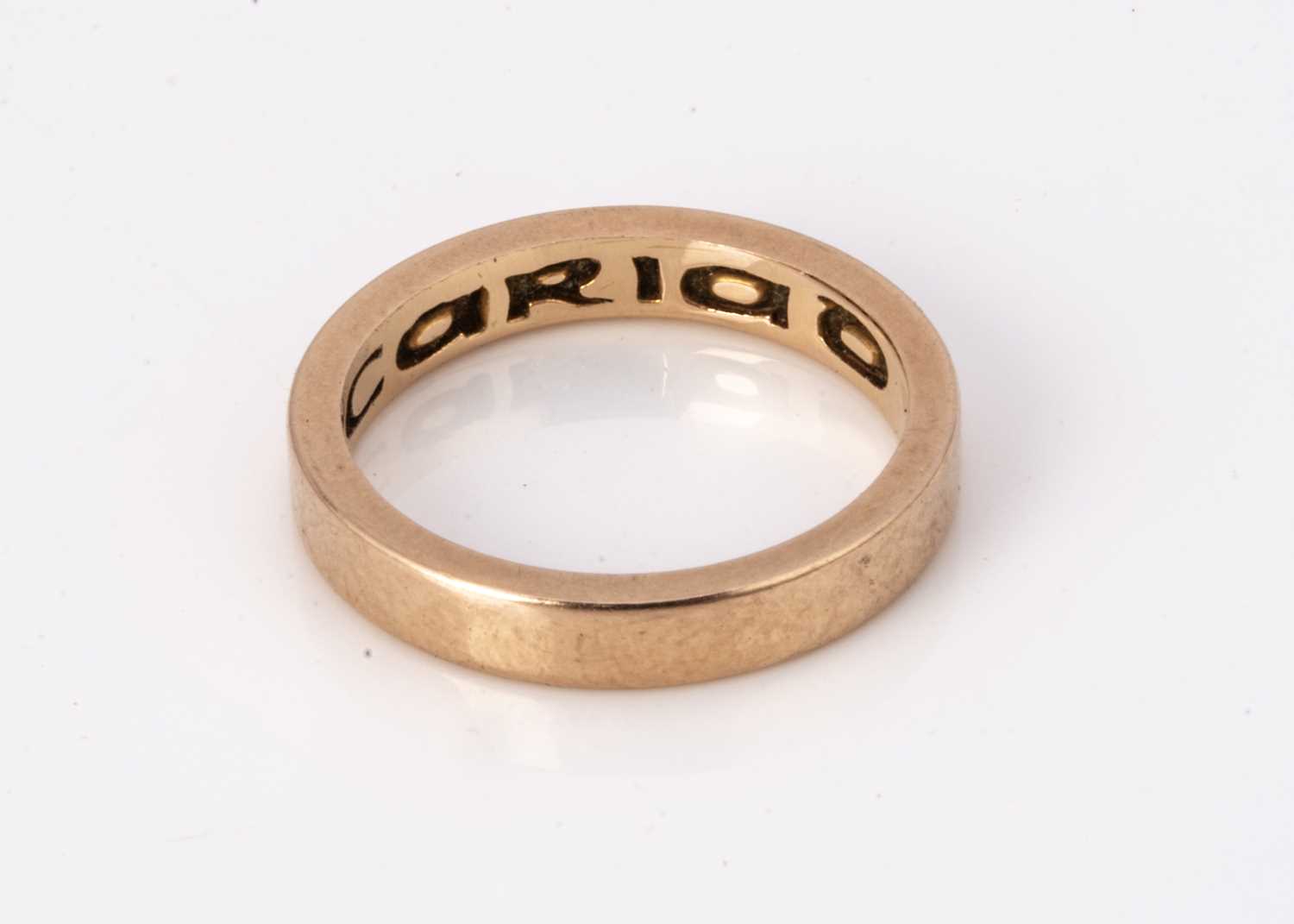 A Welsh 18ct gold court shaped wedding band,