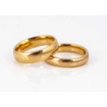 Two 22ct gold barrel shape wedding bands,