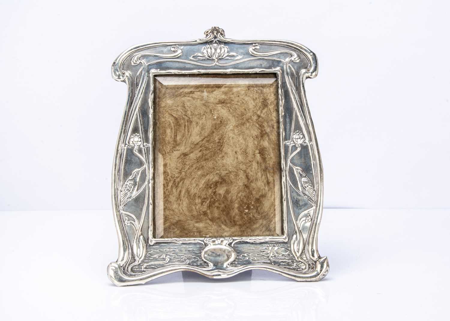 An Arts & Crafts silver mounted photograph frame,