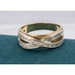 A continental 750 marked two colour diamond dress ring,