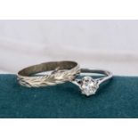 A diamond solitaire platinum ring,