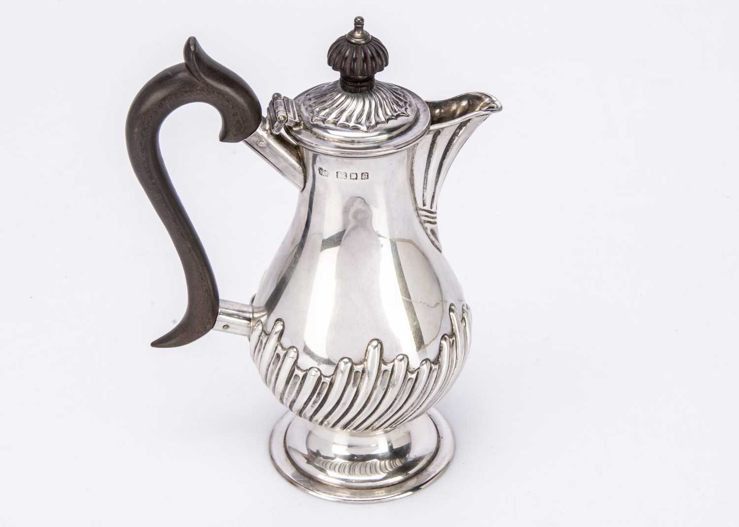 A Victorian silver hot water pot,