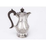 A Victorian silver hot water pot,