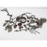 A collection of Middle Eastern white metal jewels,