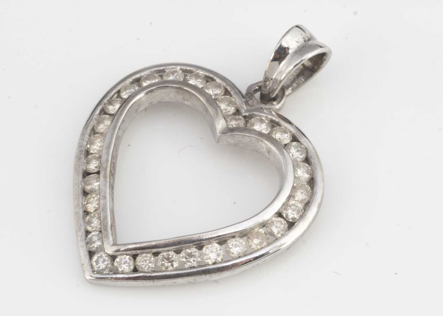 A diamond set heart pendant,