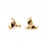A pair of continental 14k marked whales tail ear studs,