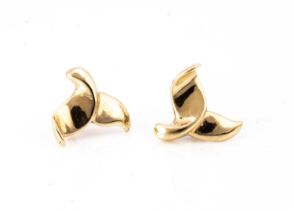 A pair of continental 14k marked whales tail ear studs,