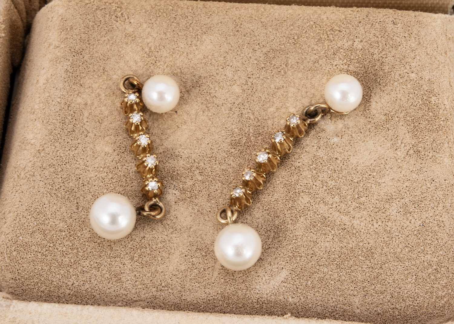 A pair of cultured pearl and diamond ear drops,