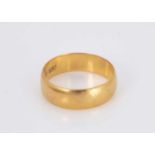 A Victorian barrel shaped22ct gold wedding band,