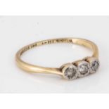 An 18ct gold and platinum set three stone illusion dress ring,