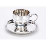 An early 20th Century continental silver teacup and saucer,