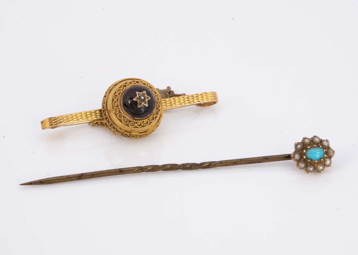 A 19th century garnet and diamond bar brooch,