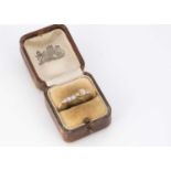 An 18ct gold five stone old cut diamond dress ring,