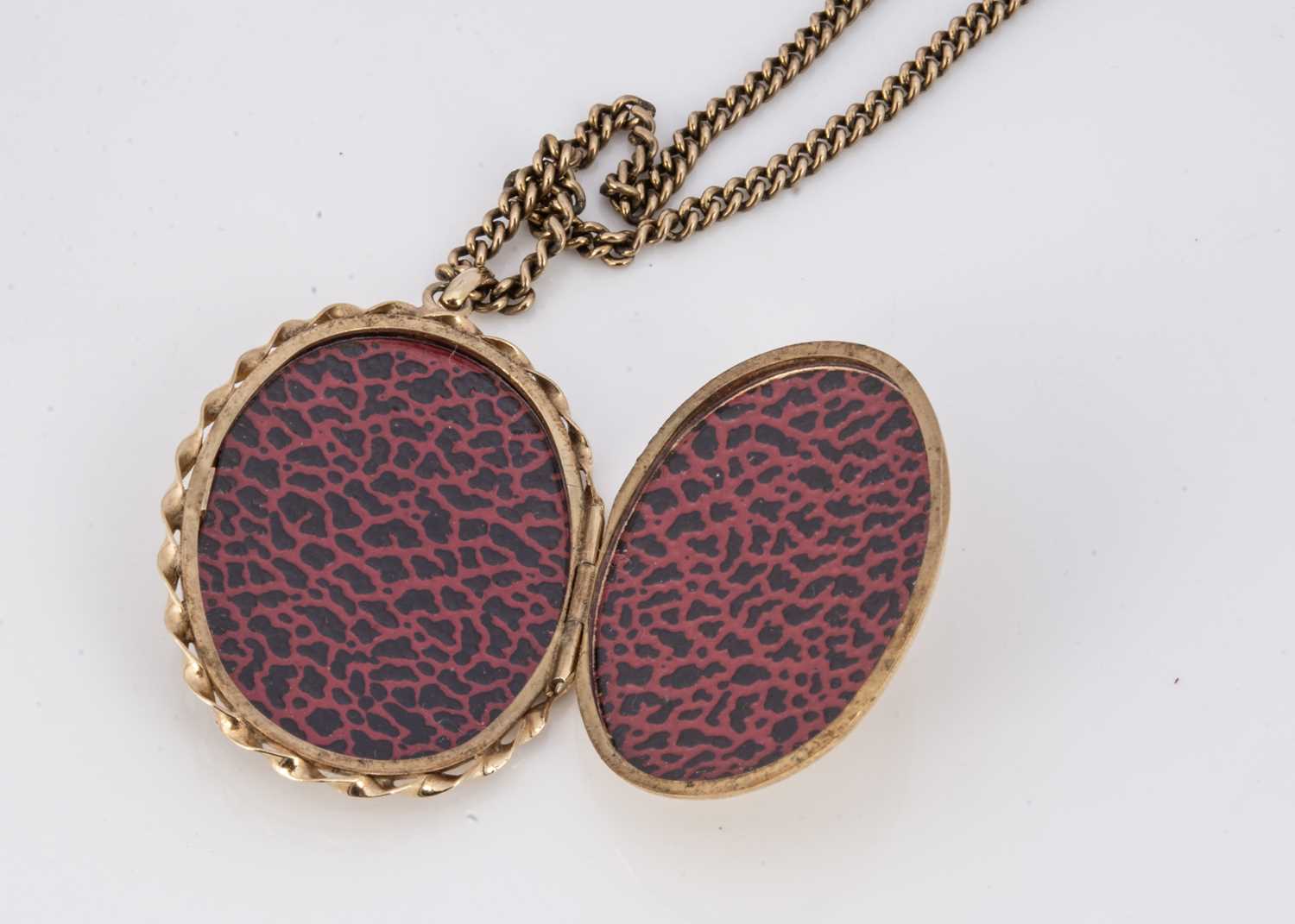 A 9ct gold oval engraved locket, - Image 2 of 3