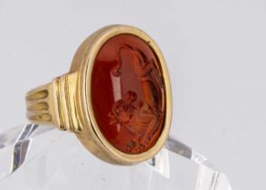 A contemporary carnelian and 18ct gold intaglio signet ring,