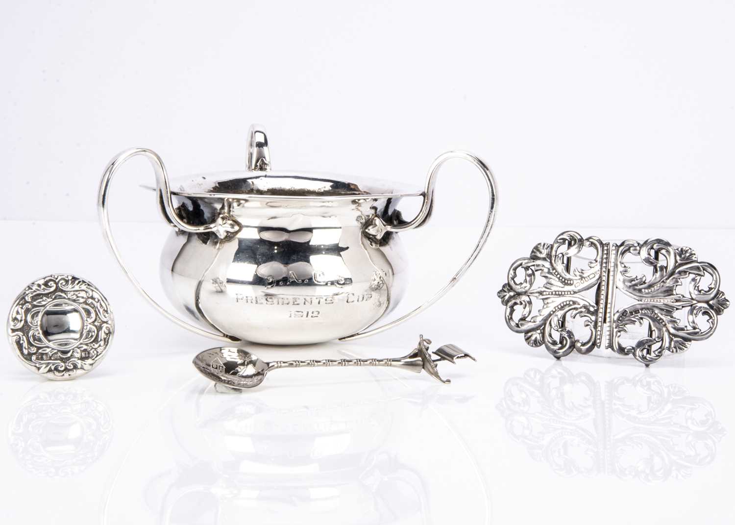 A damaged early George V silver trophy cup and three other items,