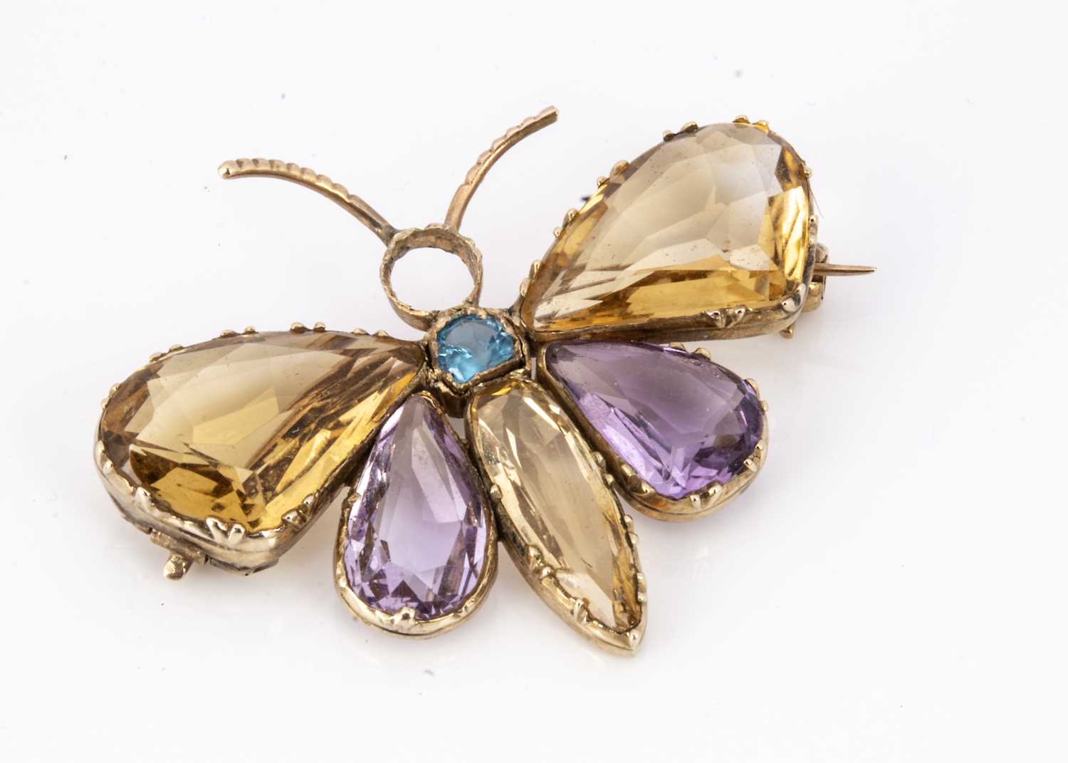 An Edwardian amethyst, Citrine and aqua gem set gold butterfly brooch,