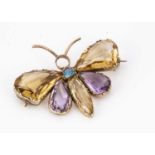 An Edwardian amethyst, Citrine and aqua gem set gold butterfly brooch,