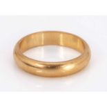 An 18ct yellow gold wedding band,