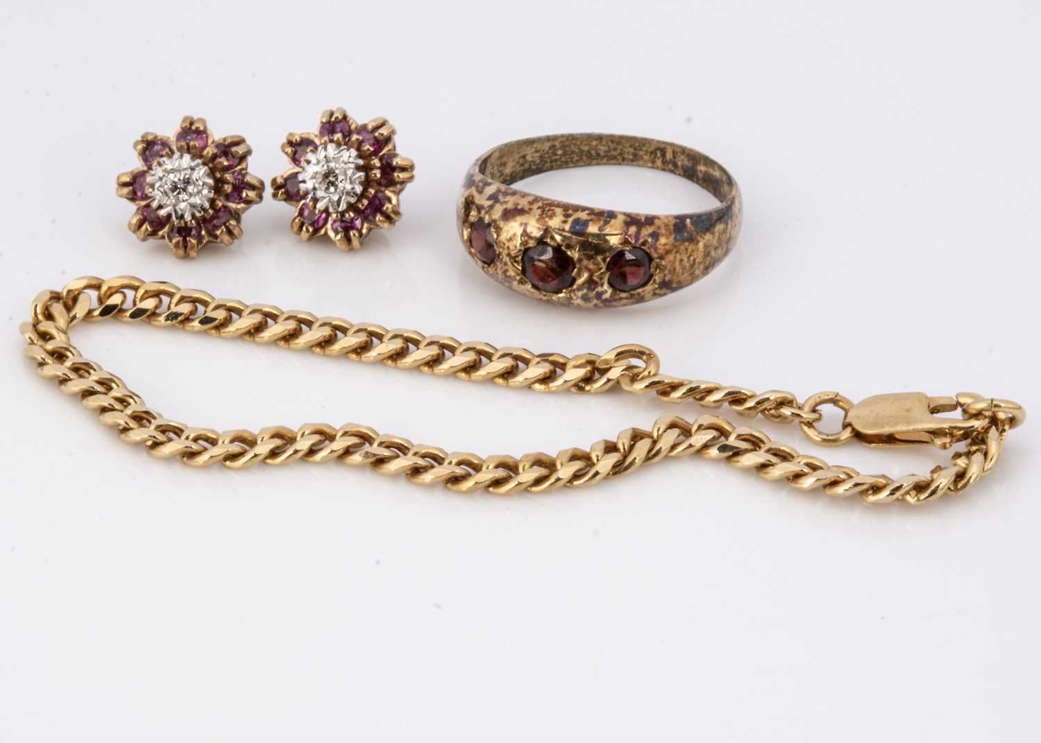 A pair of diamond and ruby earrings,