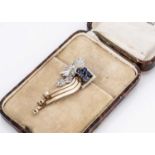 An Art Deco gold and platinum sapphire and diamond clip brooch,