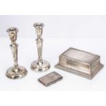 A pair of 1980s silver filled candlesticks and a 1920s silver table cigarette box and a silver cigar