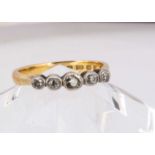 A 22ct gold wedding band converted to a five stone diamond ring,