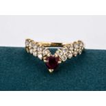 A continental 750 marked ruby and gem set wishbone ring,