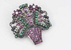 An Indian white metal and multi gem set floral brooch,
