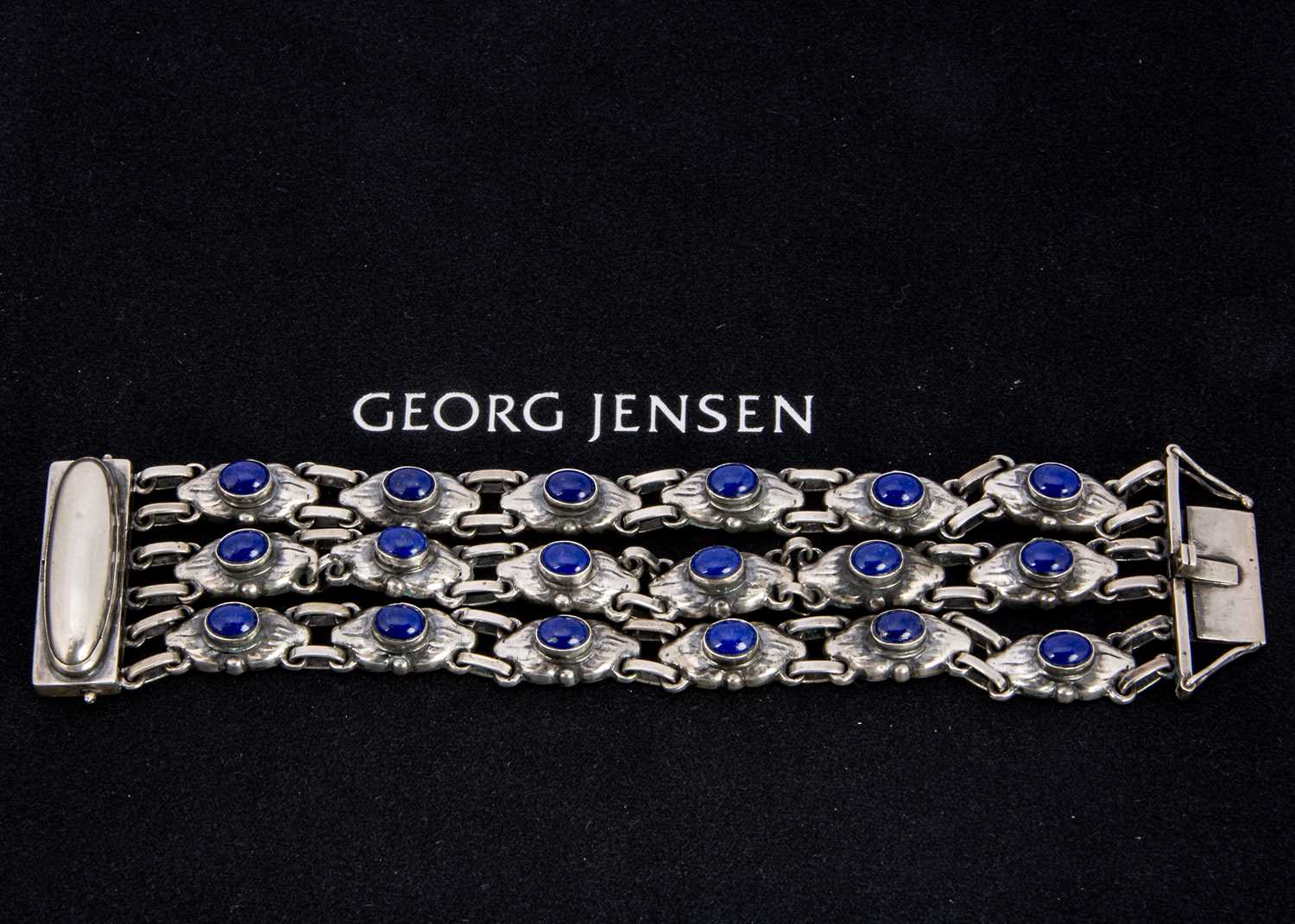 An early 20th century George Jensen silver and Lapis lazuli three strand no.15