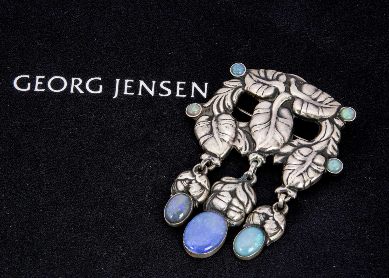 An early 20th century Georg Jensen silver and opal brooch,