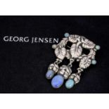 An early 20th century Georg Jensen silver and opal brooch,