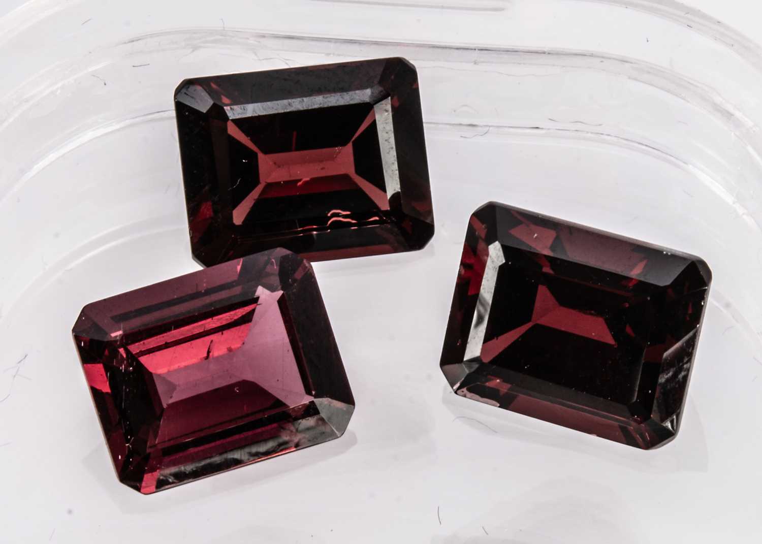 Three certificated Rhodolite Garnets,