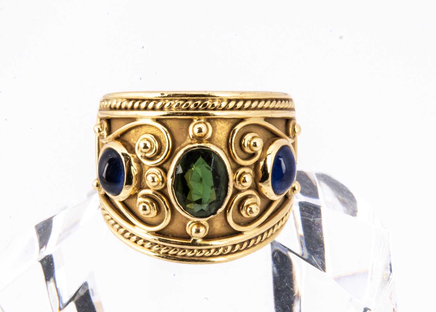 A continental 18ct gold tourmaline and sapphire dress ring,