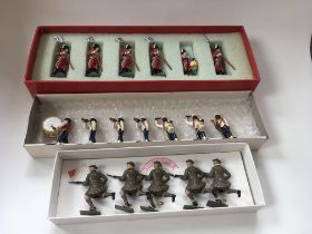 A collection of 3 boxed sets of metal toy soldiers