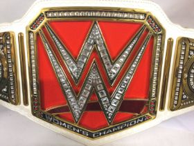 A WWE Raw Womens Championship Replica Title Belt.