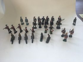 A collection of thirty metal model soldiers and sa