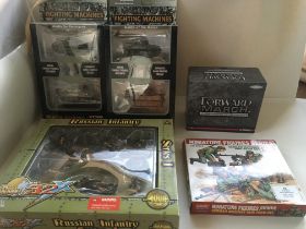 A collection of diecast and plastic model vehicles