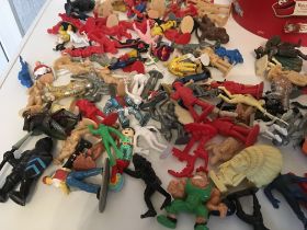 An eclectic collection of plastic figures in a var