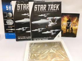 A Collection of Eagle Moss Star Trek Books. A Dedication Plaque. A Picard DVD.And a Collection of Bo