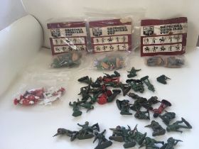A collection of 50 plus plastic toy soldiers inclu