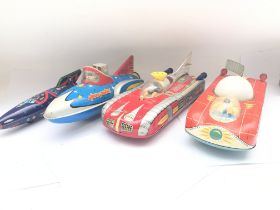 A Collection of Loose Vintage style Tin Toys including 2 Battery Operated and 2 Friction Powered.