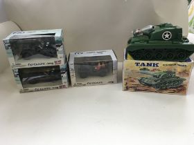 A collection of four boxed toy vehicles comprising