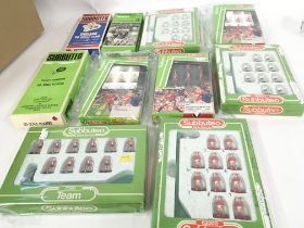 A collection of 10 boxed Subbuteo football teams.