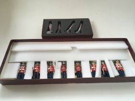 A collection of 2 boxed sets of metal toy soldiers
